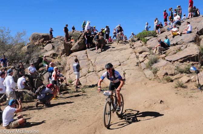 The crowds cheering the racers as they returned from their 17-mile lap