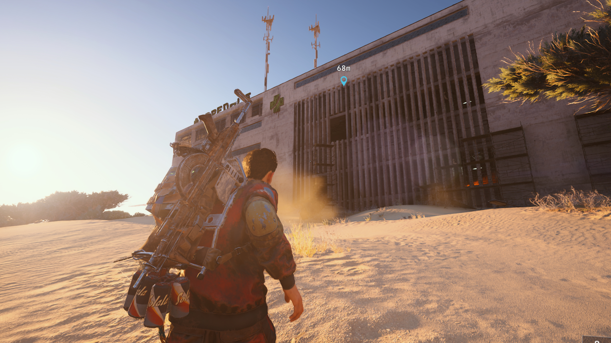 Arc Raiders laboratory reagents: A player running across sand towards Buried City&#039;s Hospital.