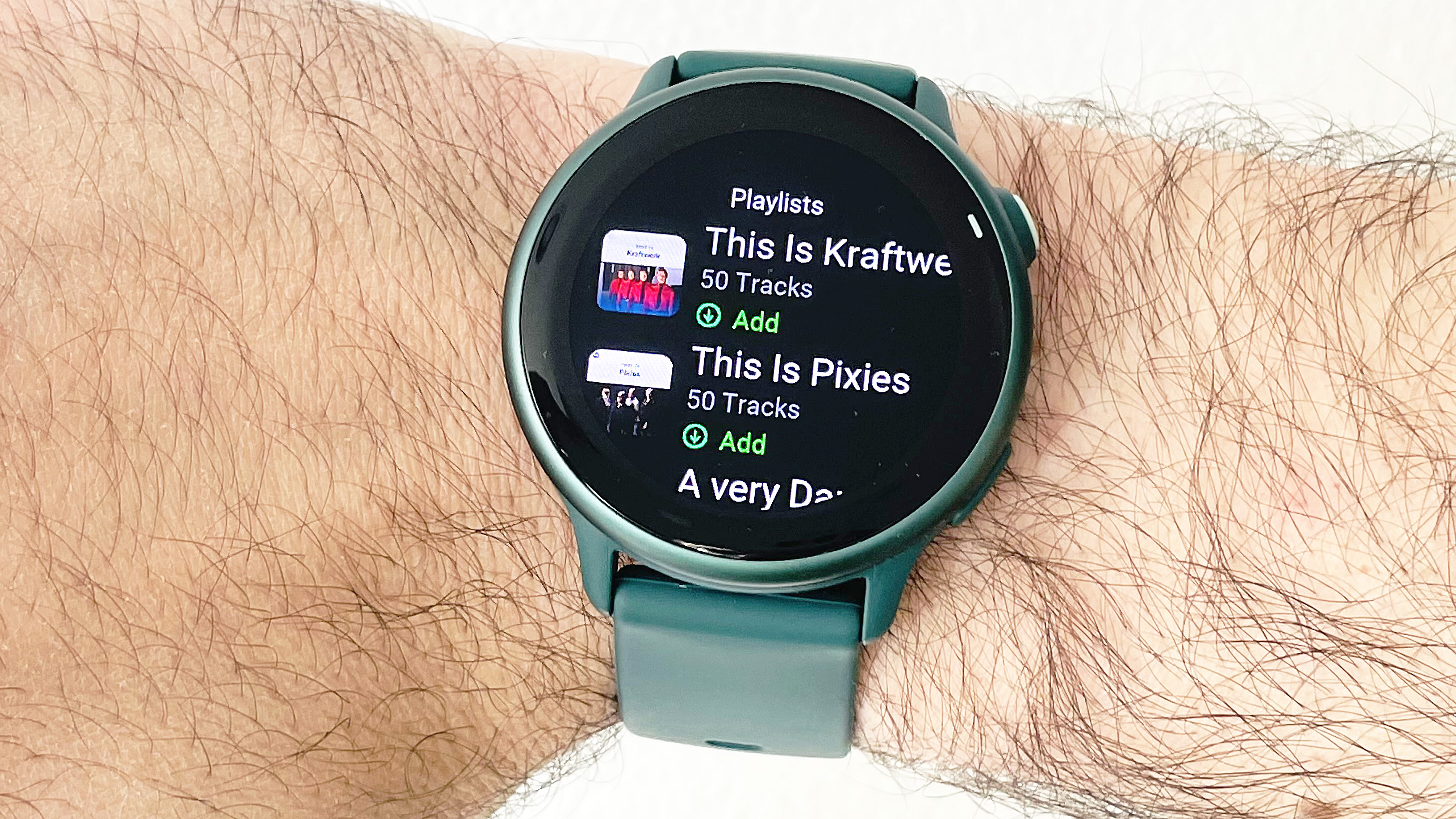 Garmin Vivoactive 6 close-up showing Spotify on the watch
