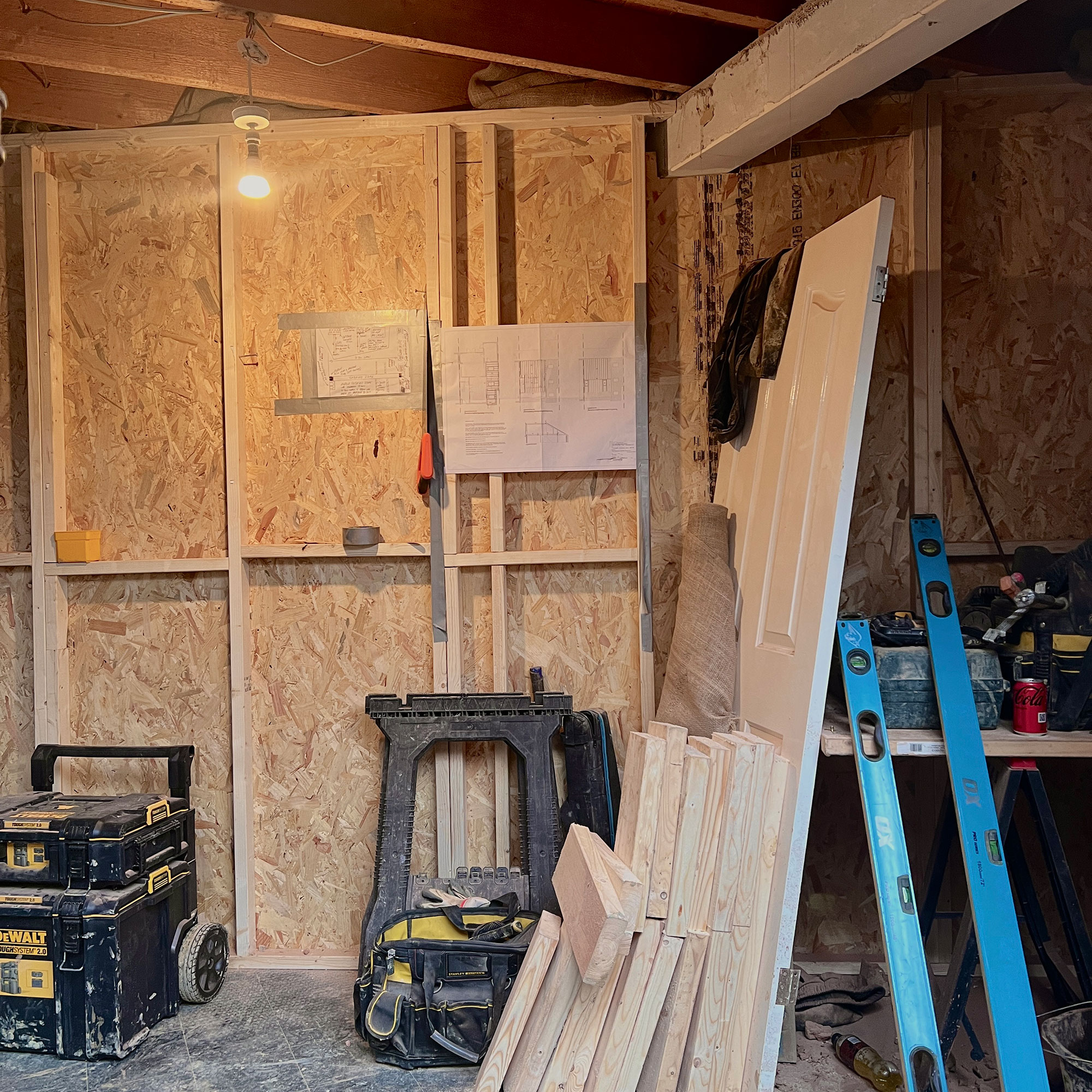 Temporary wall made from plywood in home renovation