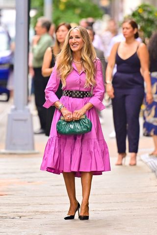 Carrie Bradshaw wearing pink tiered dress