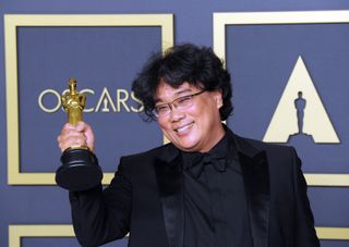 Bong Joon Ho poses with his Award for Best Director, Best Picture ('Parasite') inside The Press Room of the 92nd Annual Academy Awards held at Hollywood and Highland on February 9, 2020 in Hollywood, California.