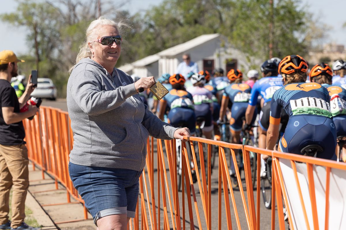 Supportive fan sees the women's field out on the inner circle road rac