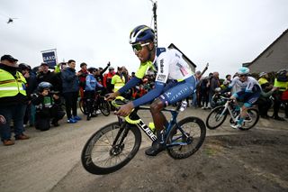 HARELBEKE BELGIUM MARCH 22 Biniam Girmay of Eritrea and Team Intermarche Wanty competes passing through the Paterberg sector while fans cheer during the 67th E3 Saxo Bank Classic Harelbeke 2024 a 2076km one day race from Harelbeke to Harelbeke UCIWT on March 22 2024 in Harelbeke Belgium Photo by Tim de WaeleGetty Images