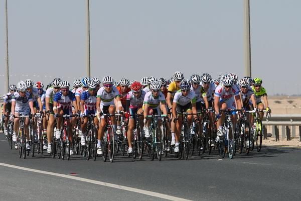 A compact bunch raced along the highway to Doha