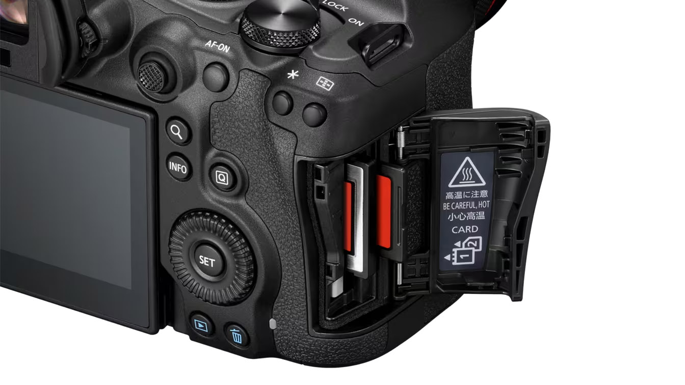 A press shot provided by Canon showing a close-up of the dual card slots on the Canon EOS R6 Mark III. The card door is open and it&#039;s possible to see an SD card as well as the new CFexpress card both positioned about halfway in.