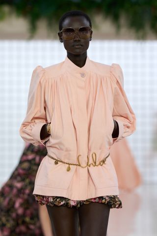 Model wears a chain belt on the Chloe Spring Summer 2025 runway.