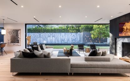 living room in modern farmhouse by Jae Omar in California