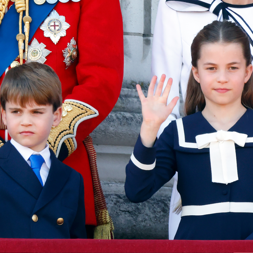 Prince Louis and Princess Charlotte wearing navy outfits and waving on Buckingham Palace&#039;s balcony