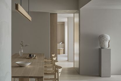 minimalist dining room with wood table