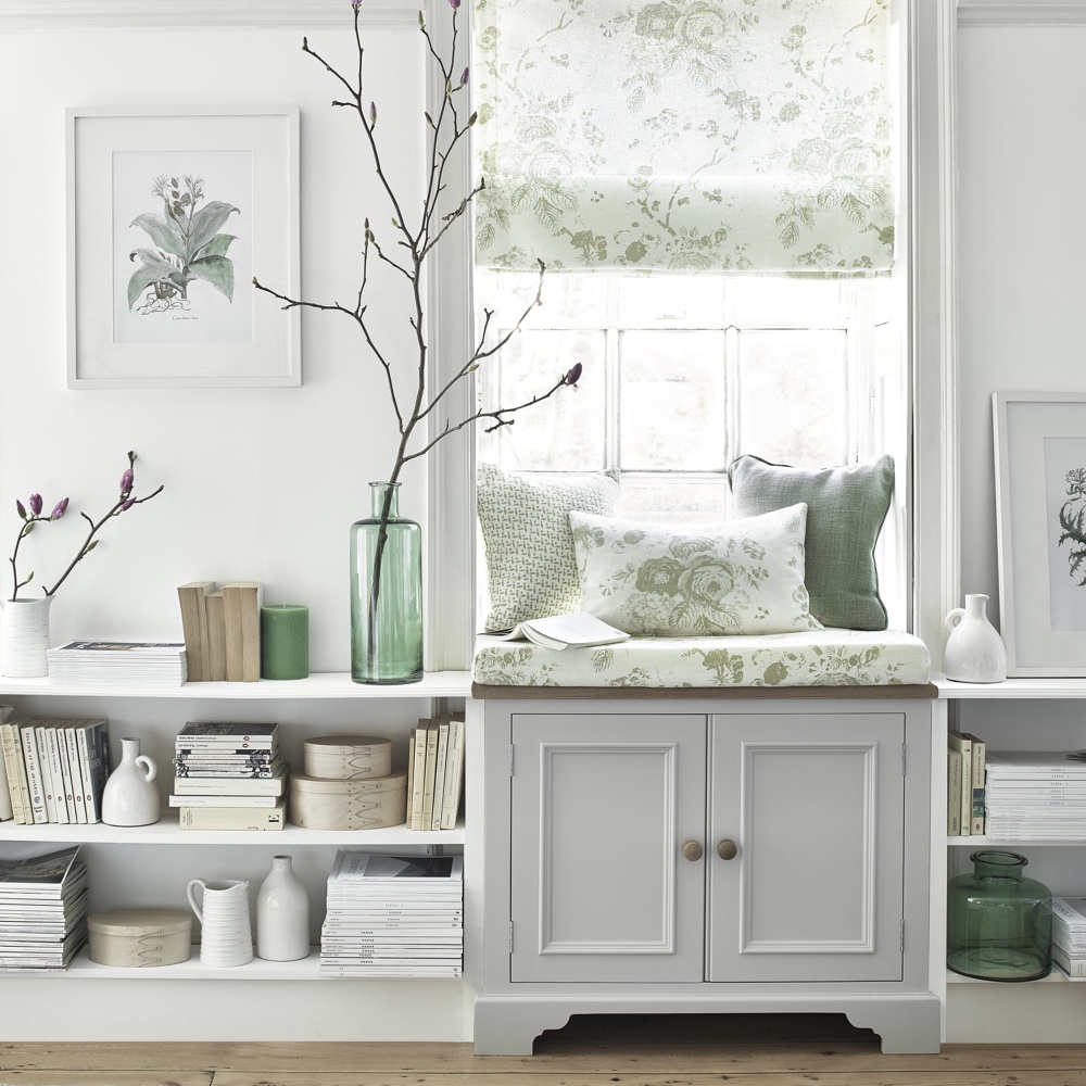 room with white wall and white chest and shelves and wooden floor