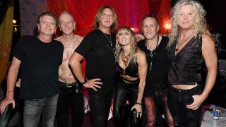 Miley Cyrus meets Def Leppard backstage at the iHeartRadio festival