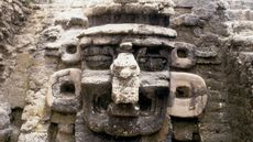 A mask of the rain god Chac decorates the facade of a pyramid at North Acropolis, in Mayan ruins, located in Tikal, Guatemala.