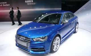 Blue Audi A3 saloon on display at a car show