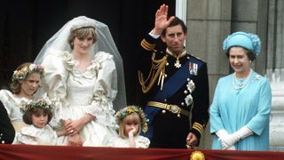 The Prince and Princess of Wales pose on the balcony of Buckingham Palace on their wedding day, with the Queen and some of the bridesmaids