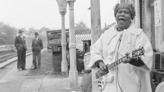 Sister Rosetta Tharpe photographed at Wilbraham Road Station in Manchester, England, while filming the Granada Television special Blues And Gospel Train, on May 7, 1964. 