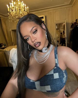 Rihanna wearing a watch choker with a denim bra top
