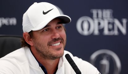 Brooks Koepka smiles during a press conference
