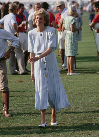 Diana, Princess of Wales (1961 - 1997) at a Cartier International Polo match on Smith's Lawn in Windsor, UK, July 1989. She is wearing a dress by Catherine Walker.