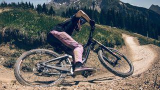 Mullet mountain bike being ridden on dusty trail