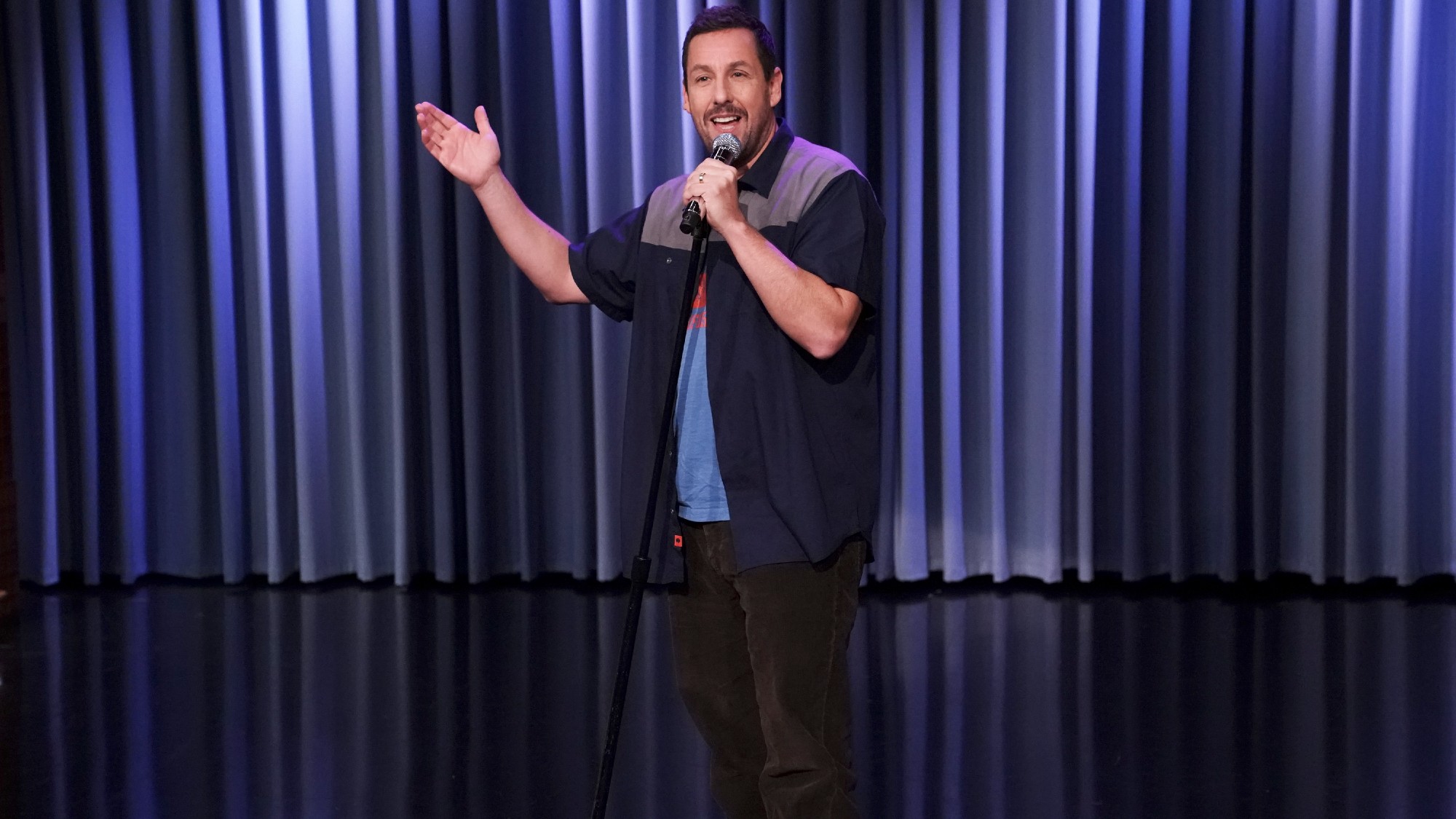 Comedian Adam Sandler sings a song on "The Tonight Show Starring Jimmy Fallon" in February 2019