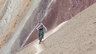 Kilian Bron riding the rainbow mountains
