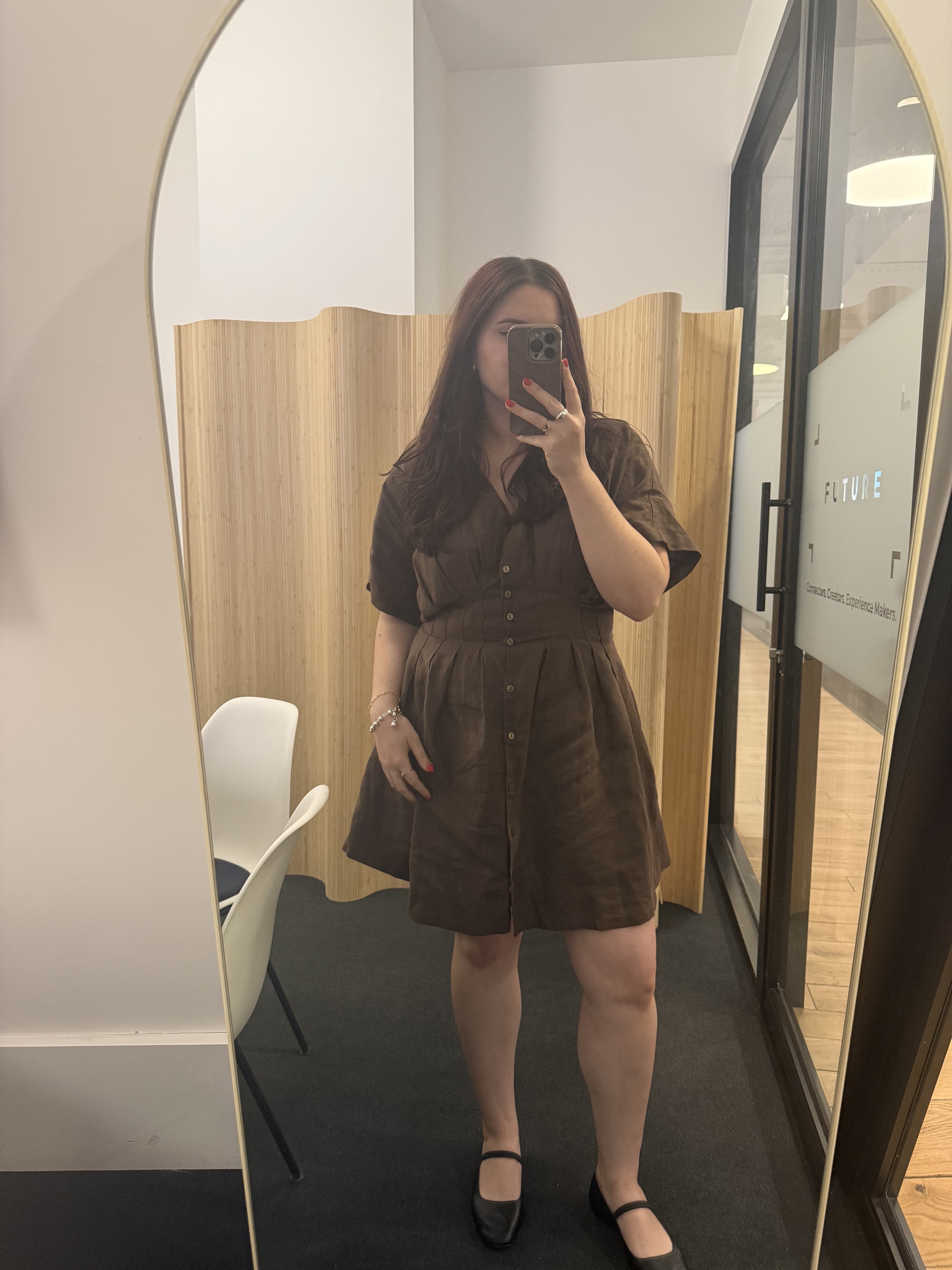 Associate E-Commerce Editor Brooke Knappenberger styling her Tobie dress in the new york office.