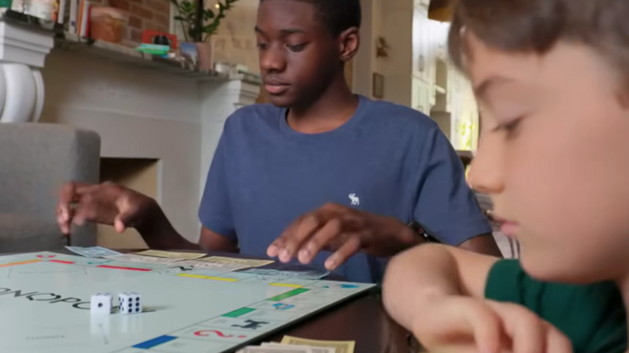 Kids playing Monopoly in the PBS documentary Ruthless: Monopoly's Secret History