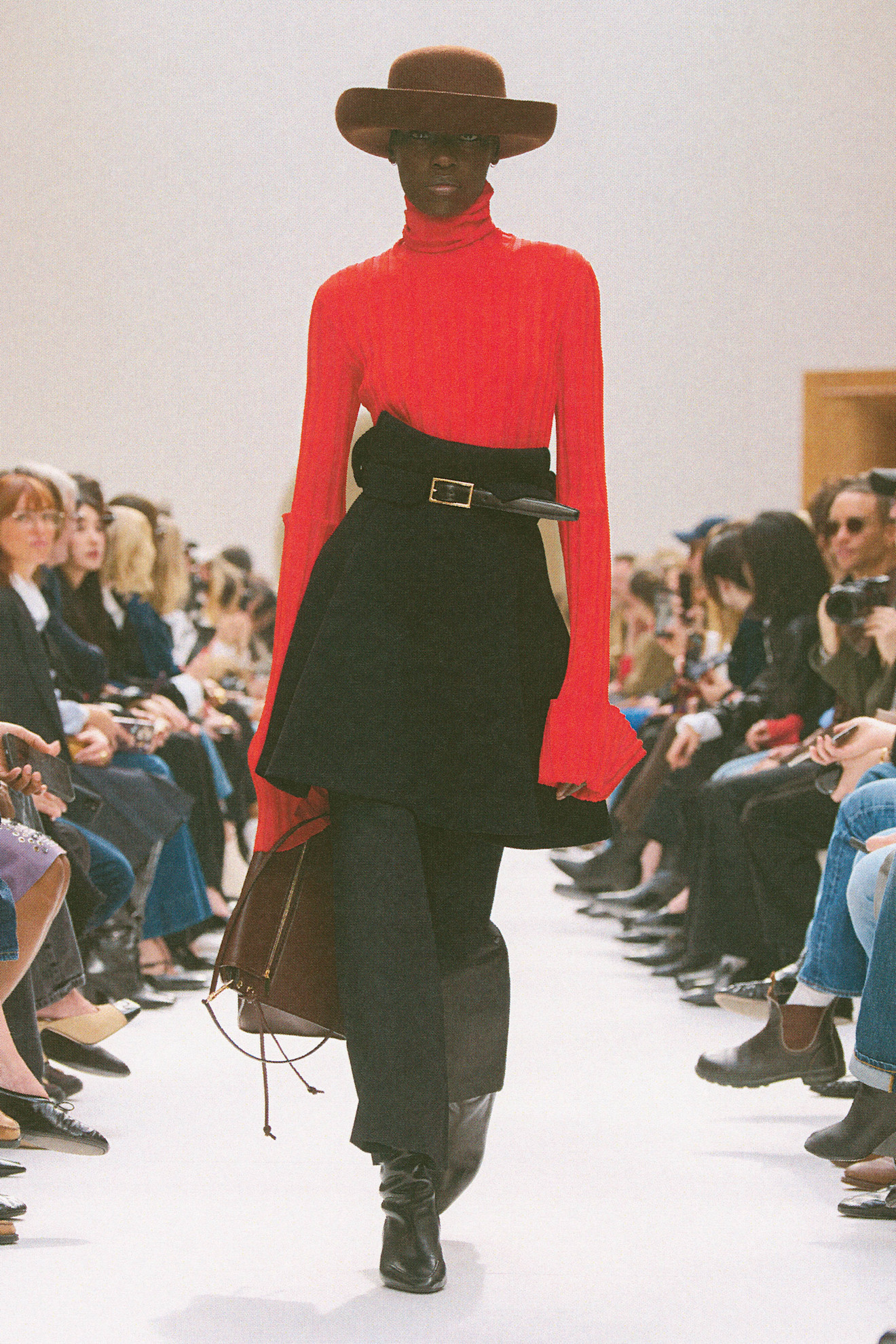 A model wore the red-and-black color combination trend on the Celine Fall 2026 runway