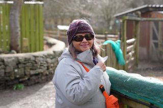 A photo of a woman smiling, taken on a Sony A1 II mirrorless camera and with a Sony FE 28-70mm F2 GM lens