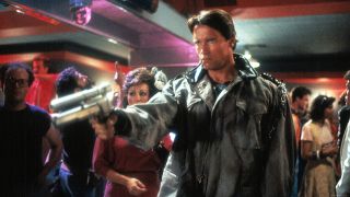 Arnold Schwarzenegger as The Terminator holding a shotgun during the sci-fi movie, The Terminator.