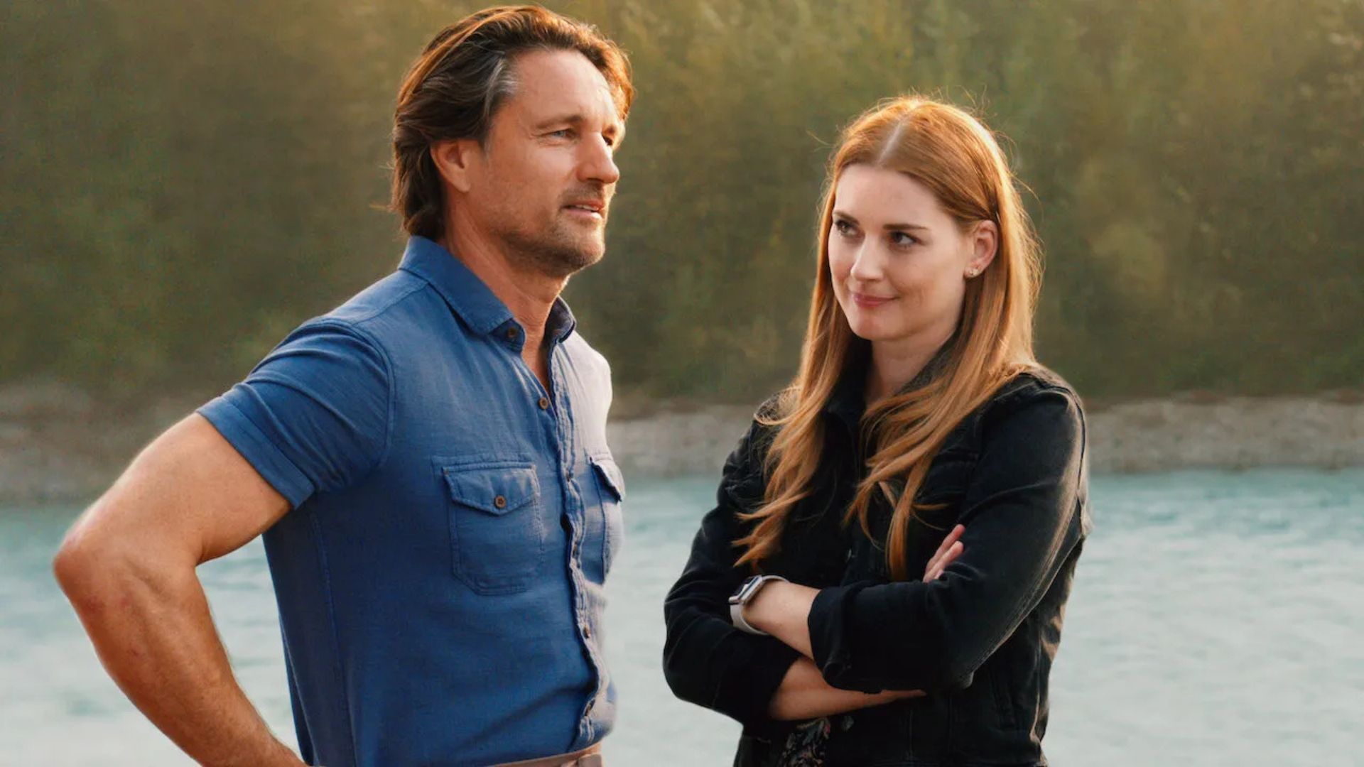 Mel folds her arms while looking at Jack, who has his hands on his hips