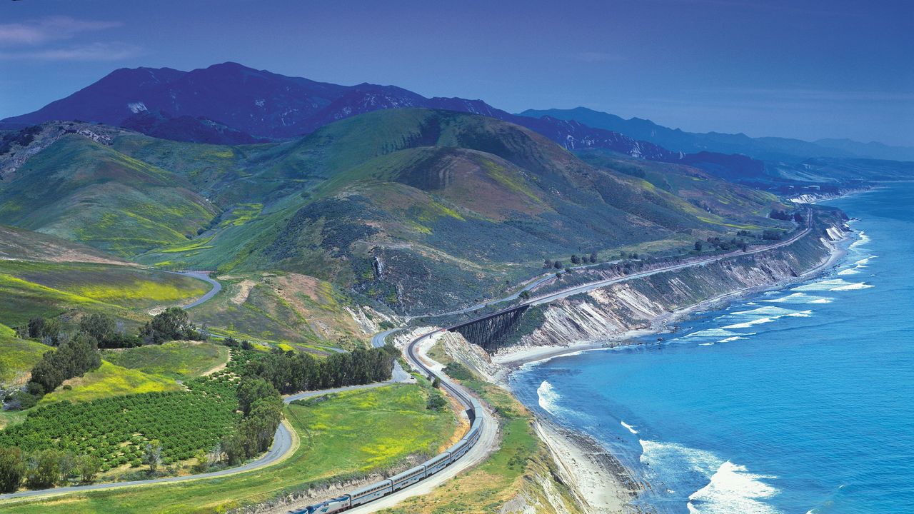 Coast, Natural landscape, Promontory, Headland, Coastal and oceanic landforms, Aerial photography, Mountain, Road, Water resources, Sea, 