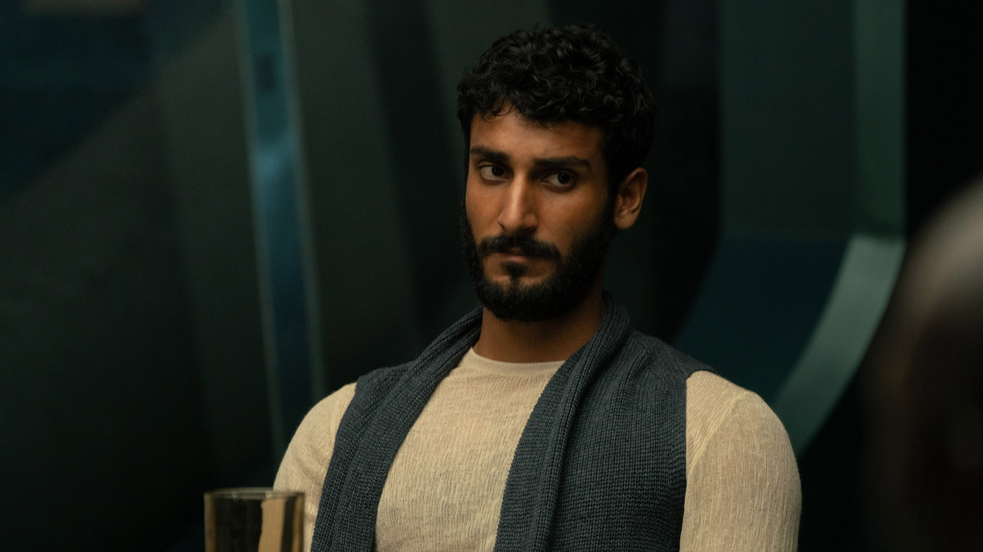 A still of Akshay Khanna in the Apple TV+ Murderbot series