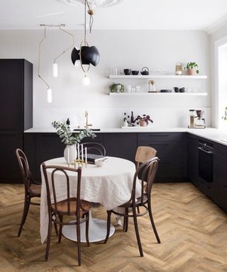 moduleo wood effect parquet flooring in a dark charcoal kitchen