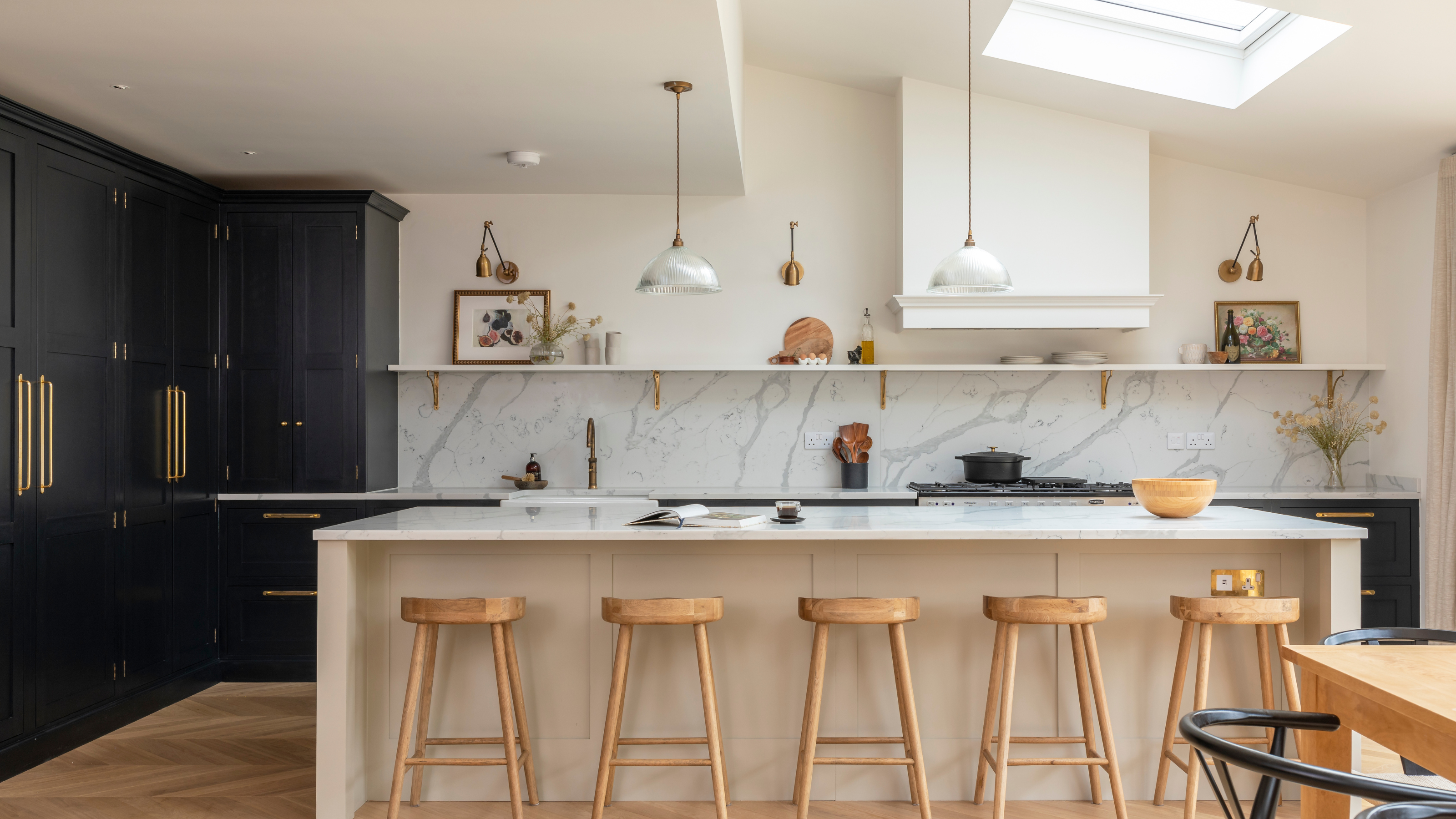 charcoal shaker kitchen with white kitchen island and marble backsplash.