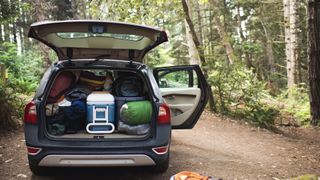 packing a car boot with camping kit