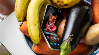 The Samsung Galaxy Z Flip 3 in a bowl of fruit