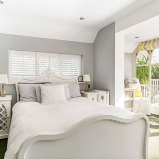 master bedroom with white walls