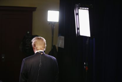 Donald Trump prepares for a live TV interview.