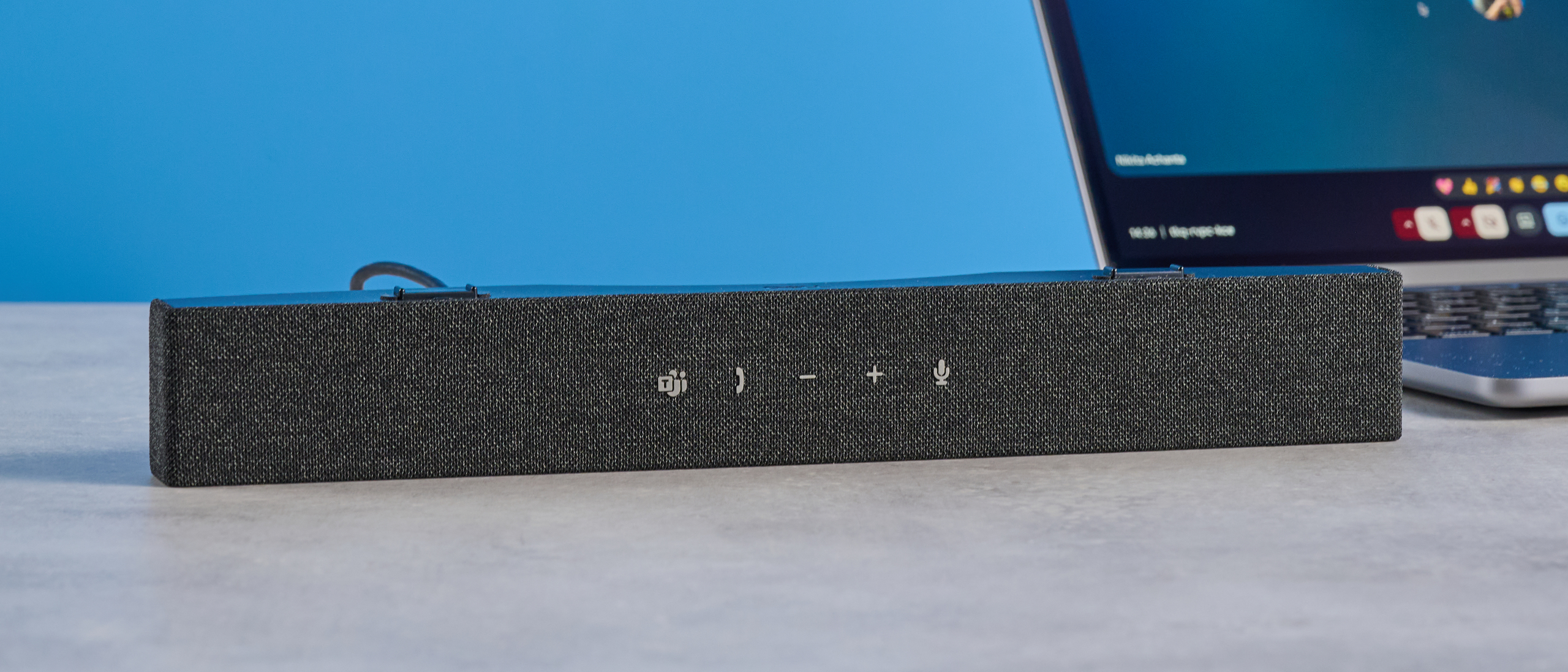 Dell SB725 computing conference soundbar photographed on a blue background