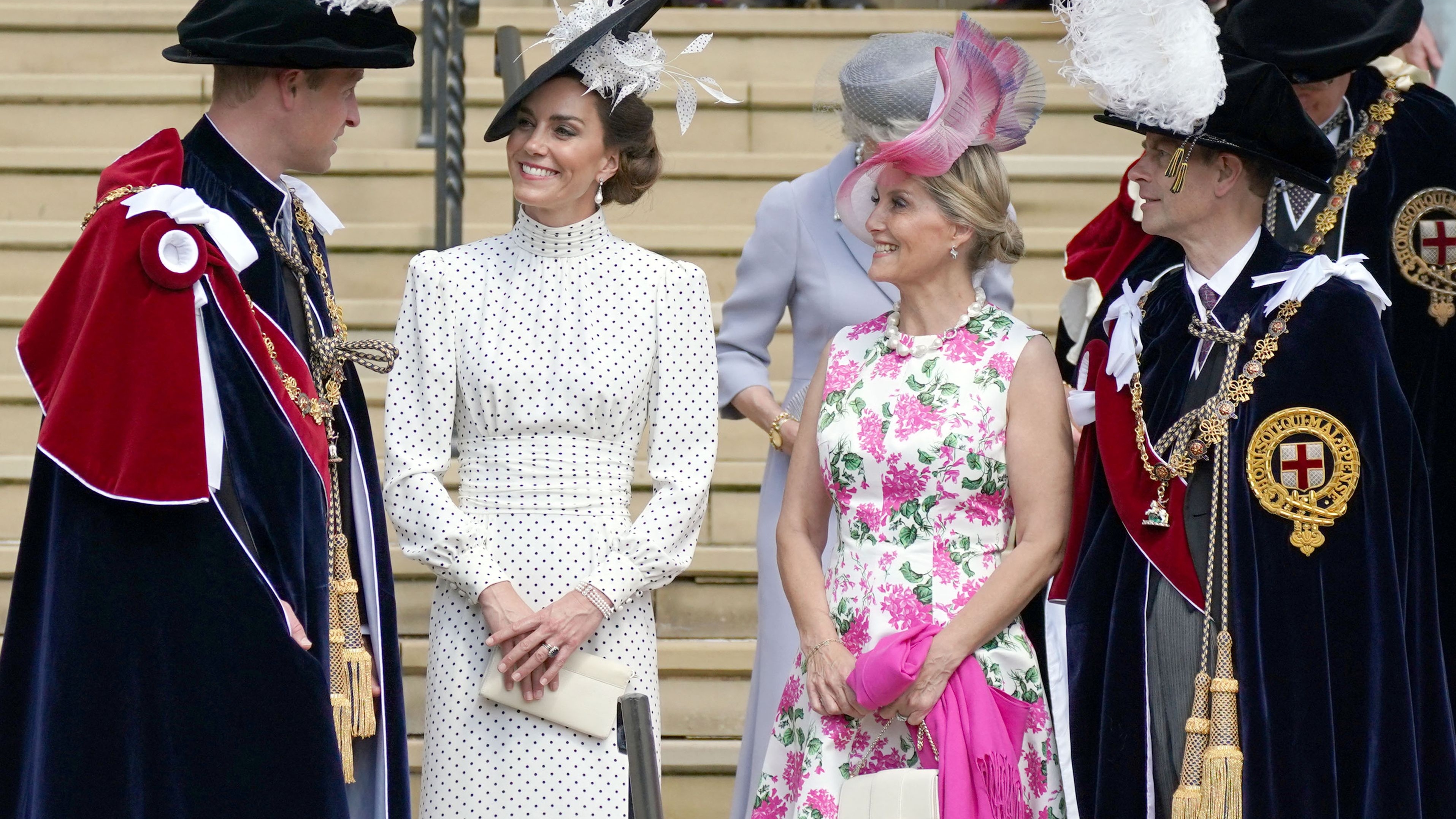 Prince William, Catherine, Princess of Wales, Sophie, Duchess of Edinburgh and Prince Edward, Duke of Edinburgh react at St George's Chapel after attending the Most Noble Order of the Garter Ceremony in Windsor Castle