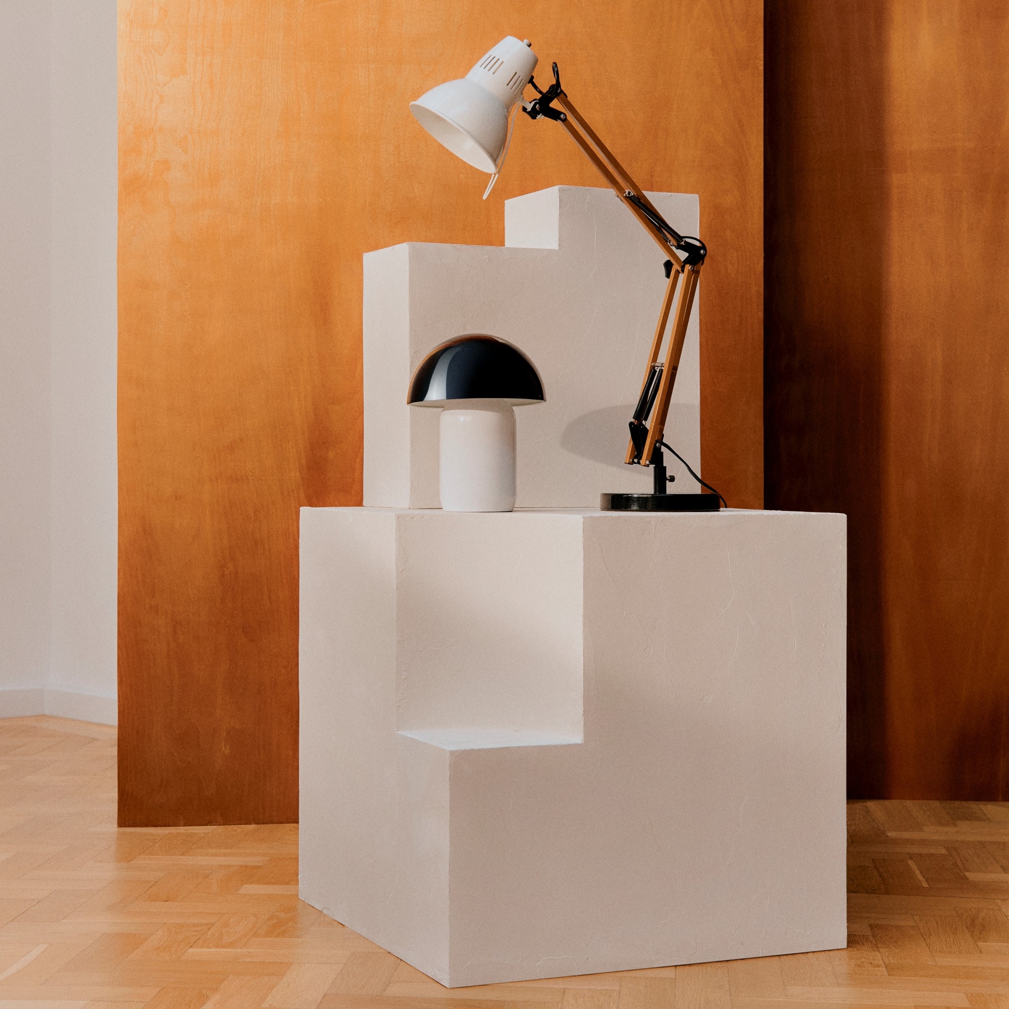 The lamps from John Cooper's collection for John Lewis displayed on a white pillar