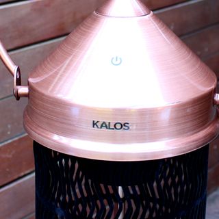 The Kettler Kalos copper lantern patio heater top with on/off switch