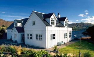 A pretty Scandinavian style custom build home on a stunning waterside plot in the Highlands