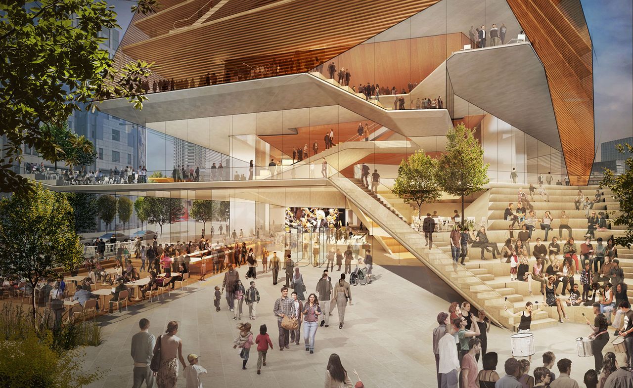 Design visualization of the London Centre for Music entry plaza. We see a staircase leading to different levels that are an open concept. The image is filled with people walking around, or sitting at the cafeteria to the left.