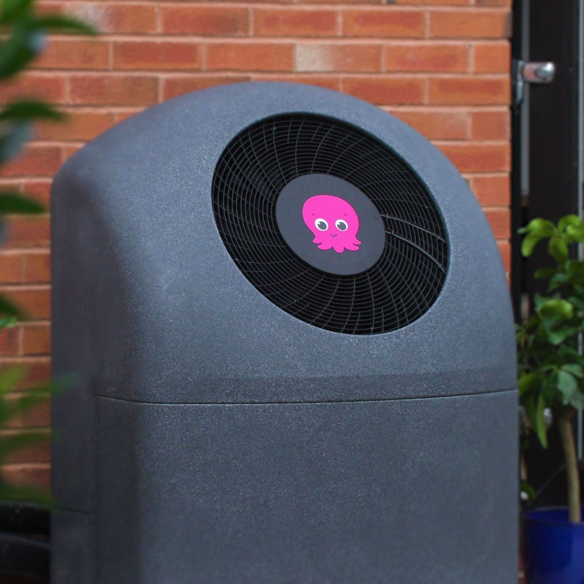 Octopus Cosy 6 heat pump against brick wall