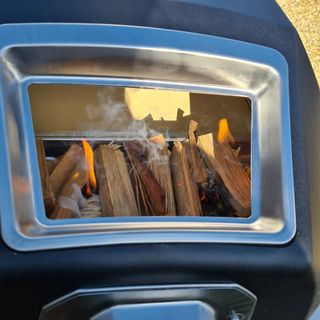 A close up of wood burning in the Ooni Karu 16 Multi-Fuel Pizza Oven