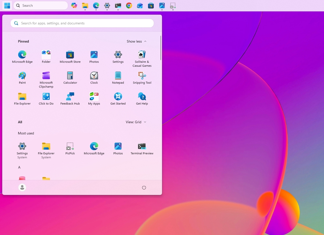 Windows 11 desktop with the Taskbar at the top of the screen.