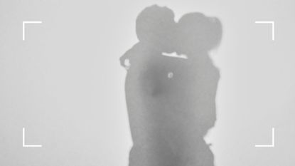 Shadow silouhette of man and woman kissing, representing the 5 signs you are in a karmic relationship